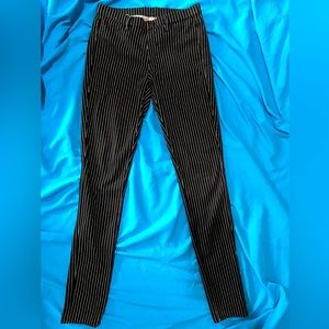 Uniqlo black striped skinny stretchy jeans. Never worn. Size Small